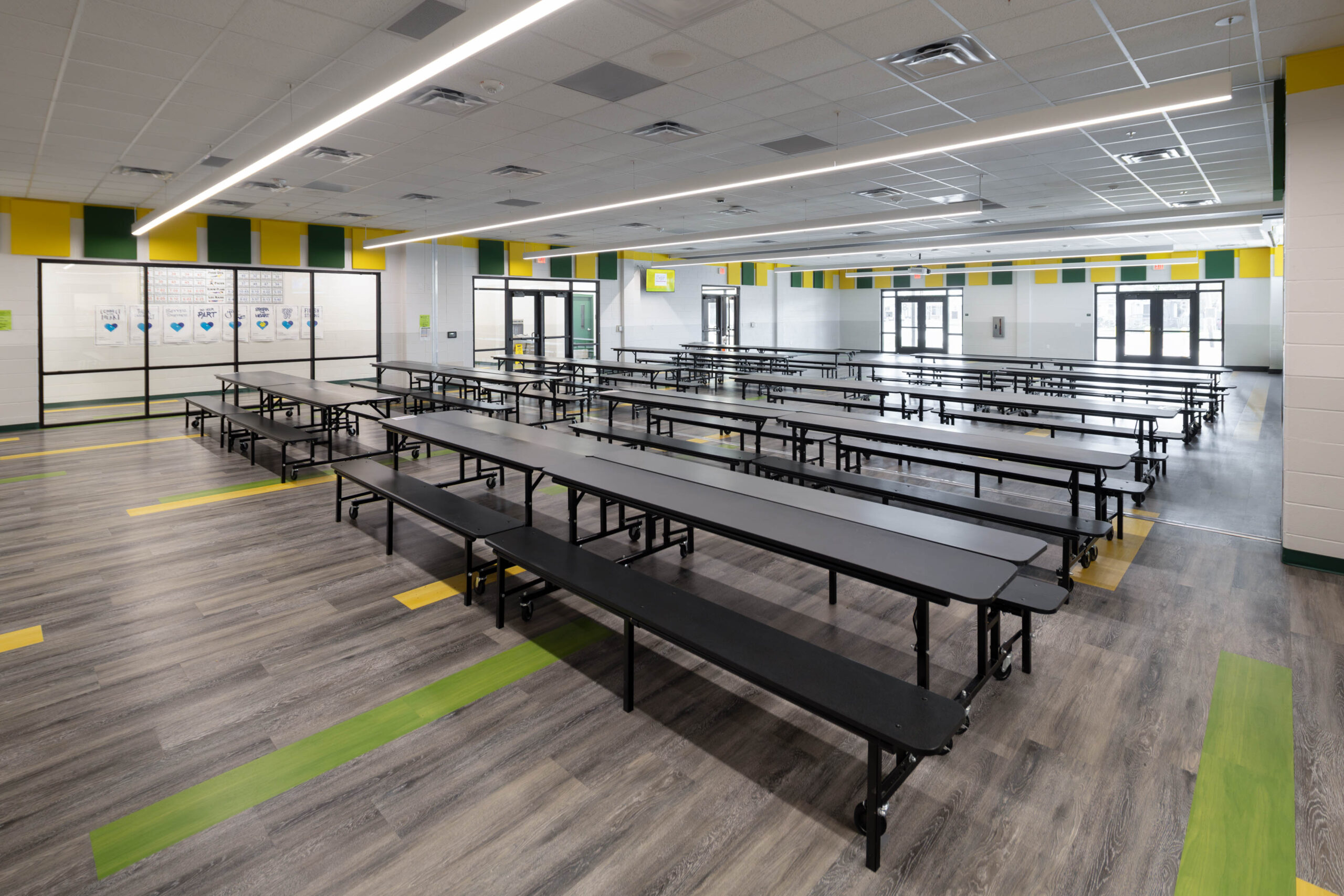 Construction team installing drop ceiling grid